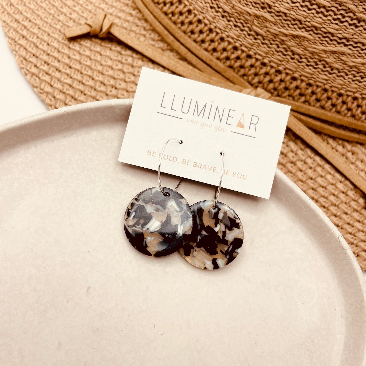 Neutral Black/white resin earrings with hypoallergenic sterling silver hoops for sensitive ears.
